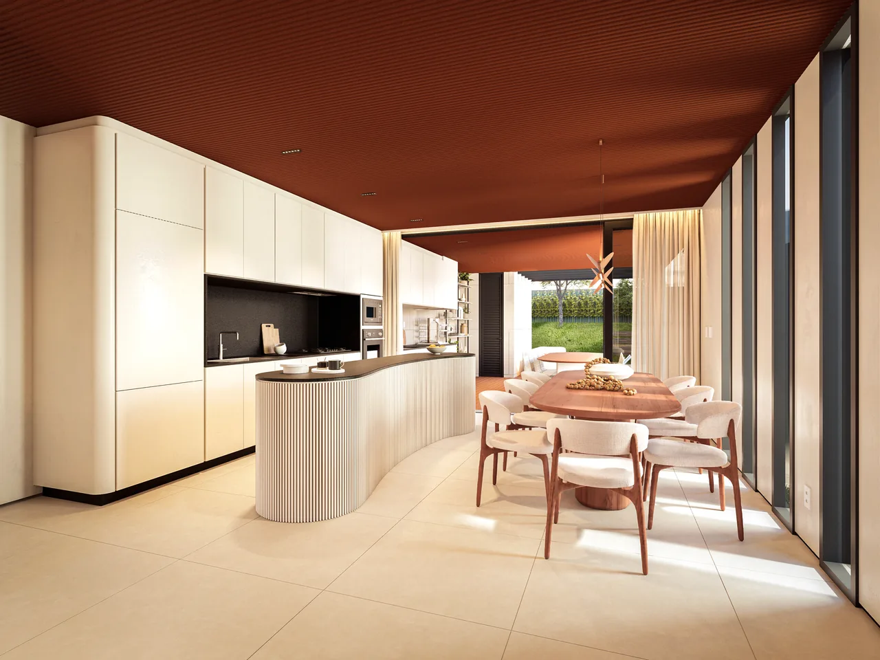 Cozinha com ilha curva e mesa de jantar